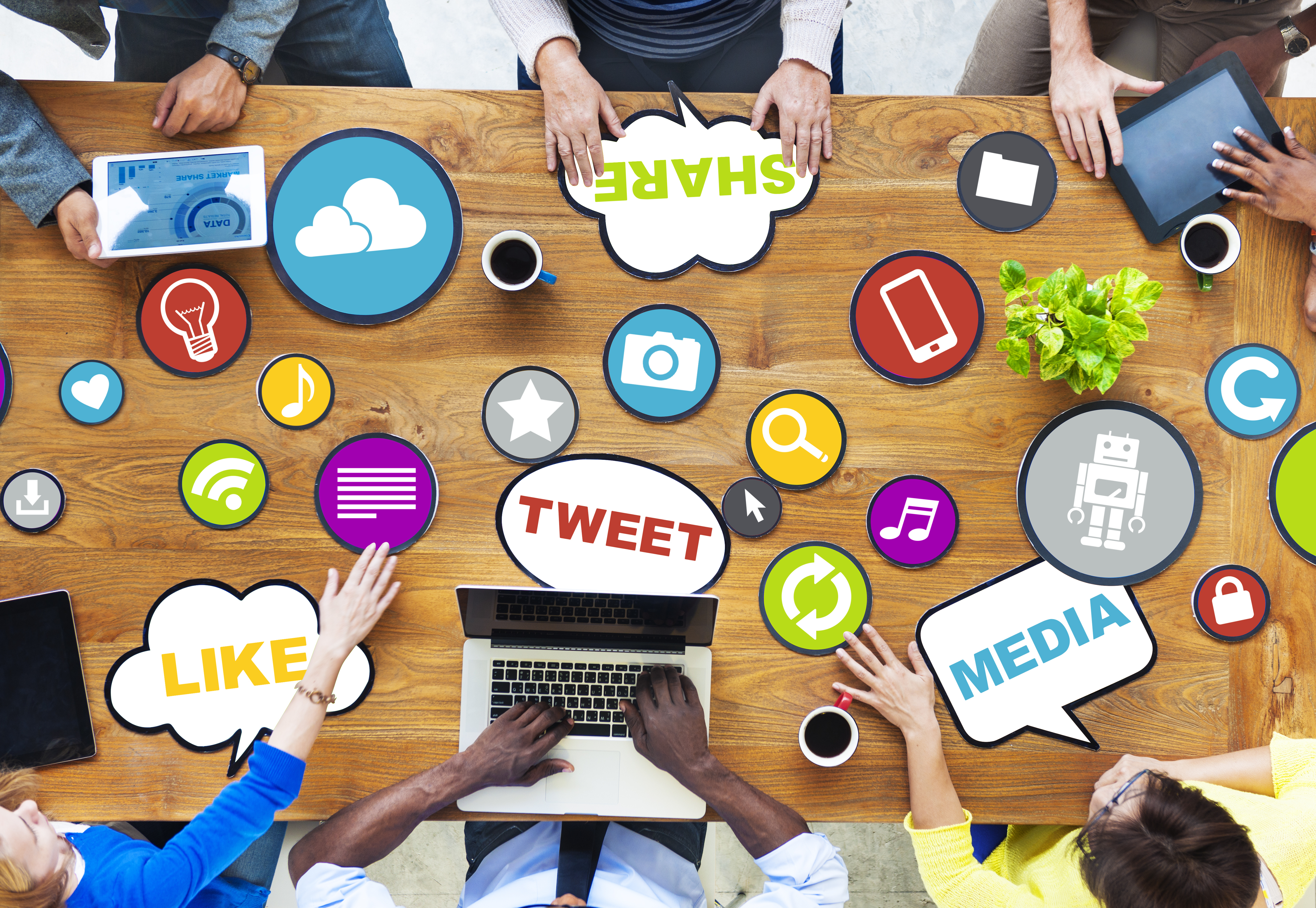 People at a Table Sharing Social Media Items